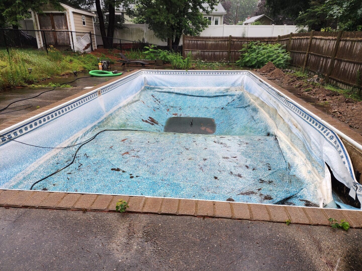 A pool that has been cleaned and is in need of repair.